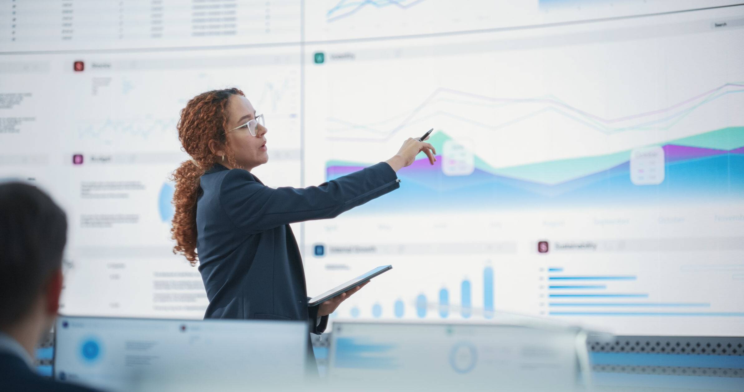 woman presenting graphs and charts