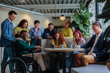 Diverse, happy group of colleagues around a table